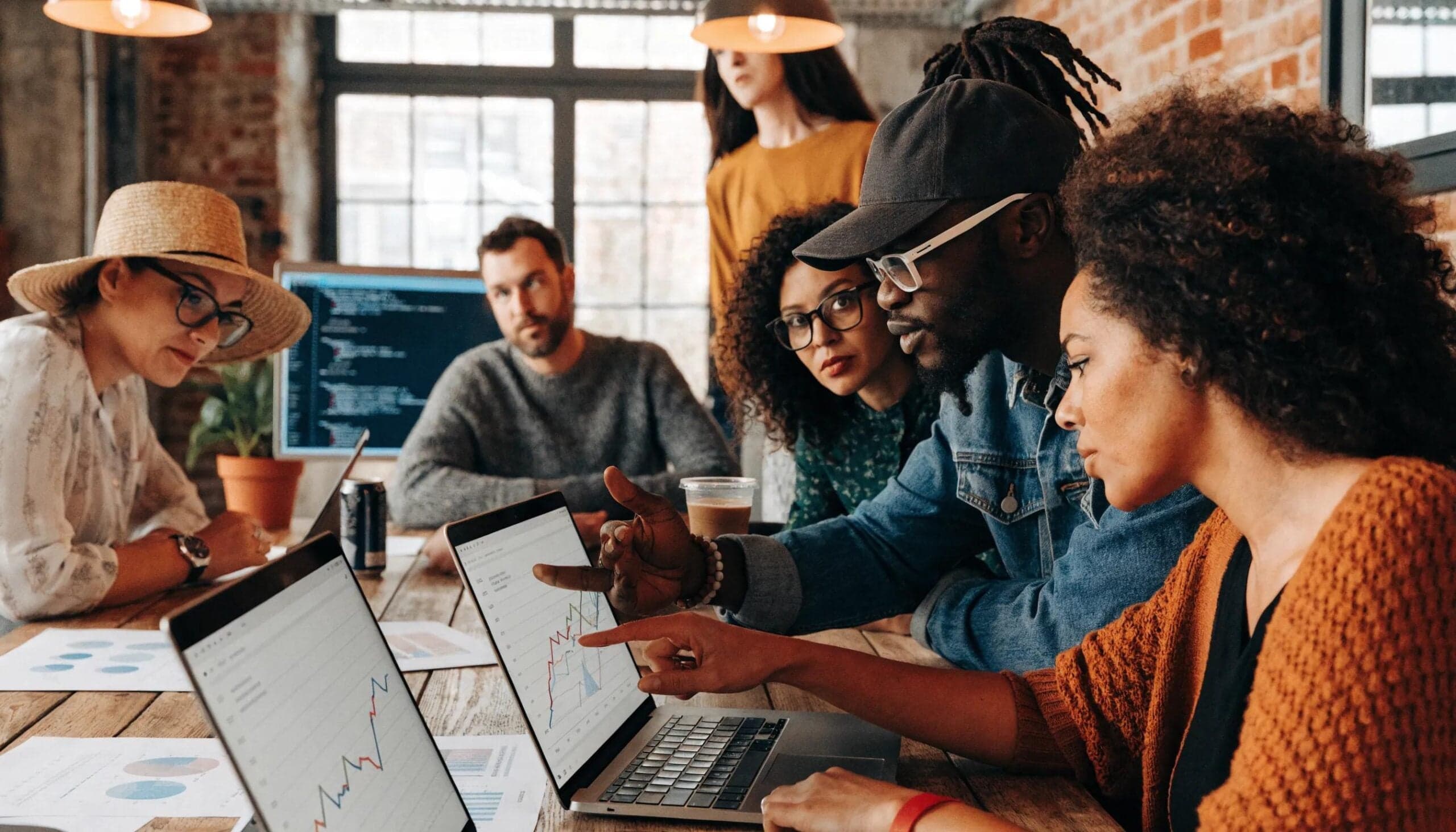 Diverse professionals collaborating on AI-driven SEO strategies in a modern workspace